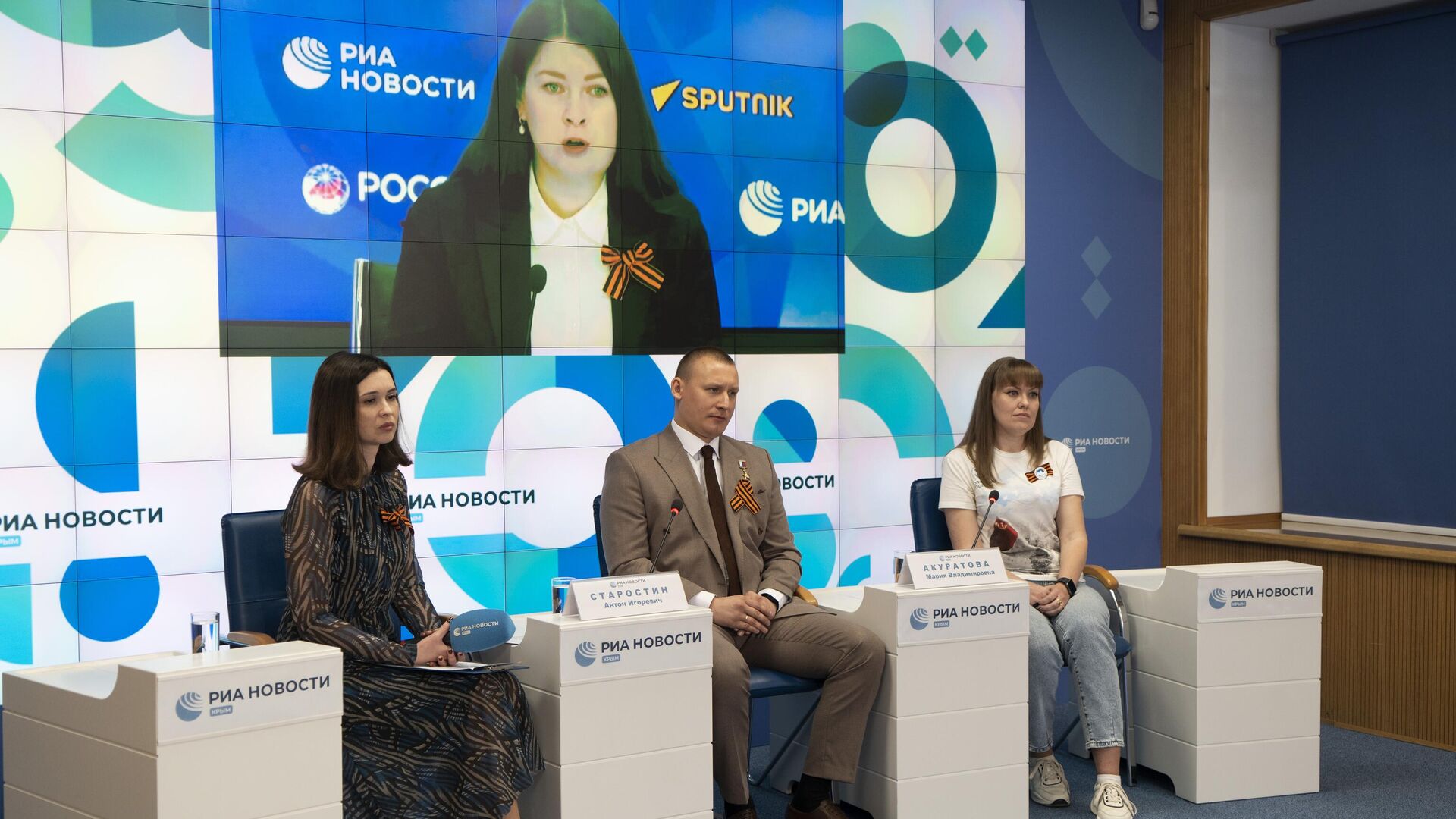 Видеомост Москва — Симферополь, посвященный старту акции Георгиевская ленточка. Видеомост Москва — Симферополь, посвященный старту акции Георгиевская ленточка. - РИА Новости, 1920, 24.04.2025