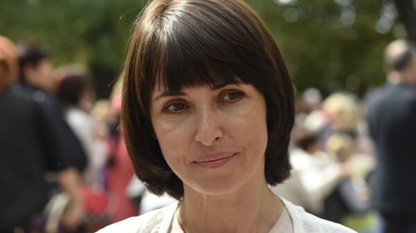 Руководитель межрегиональной общественной организации Русское единство Елена Аксенова на благотворительной акции Белый цветок