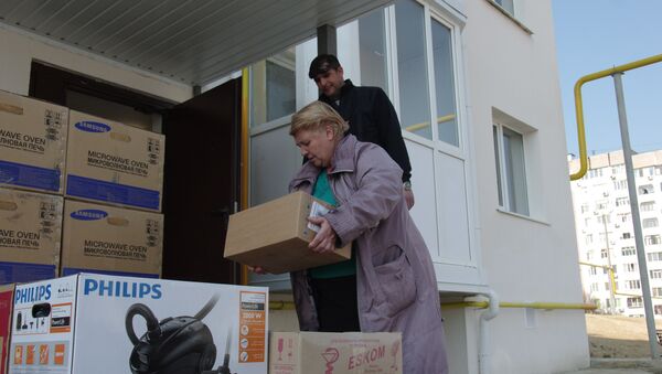 Переселенцы из зоны строительства моста через Керченский пролив переезжают в новые дома