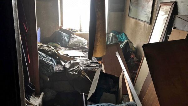 Последствия пожара в квартире пятиэтажного дома в городе Щелкино. 24 января 2019