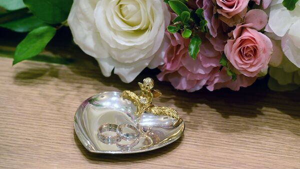 Обручальные кольца. Архивное фото Обручальные кольца. Архивное фото